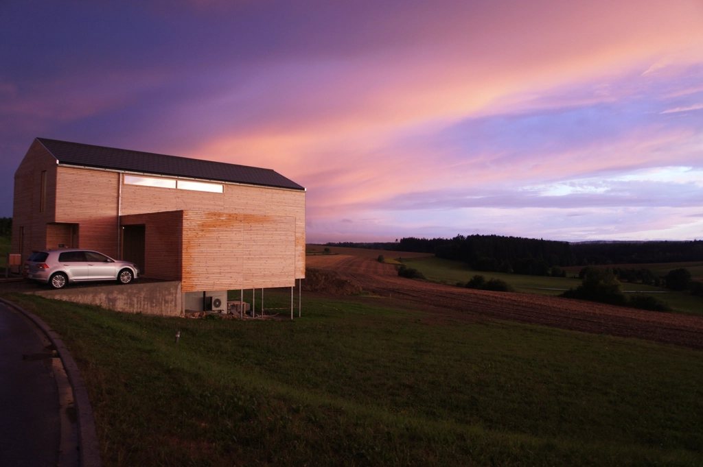 Timber barn house at sunset