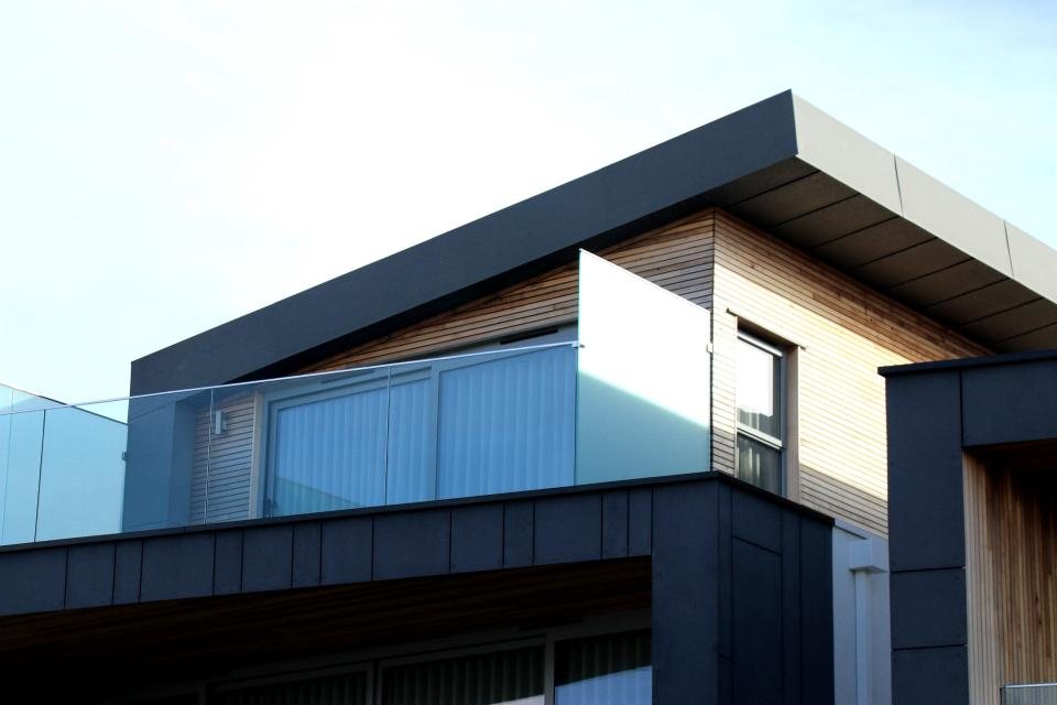 Cantilevered upper floor with a glass balcony