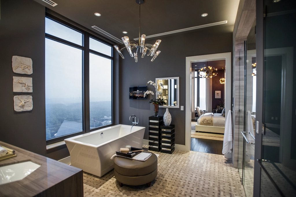 Freestanding bath in a dark master suite