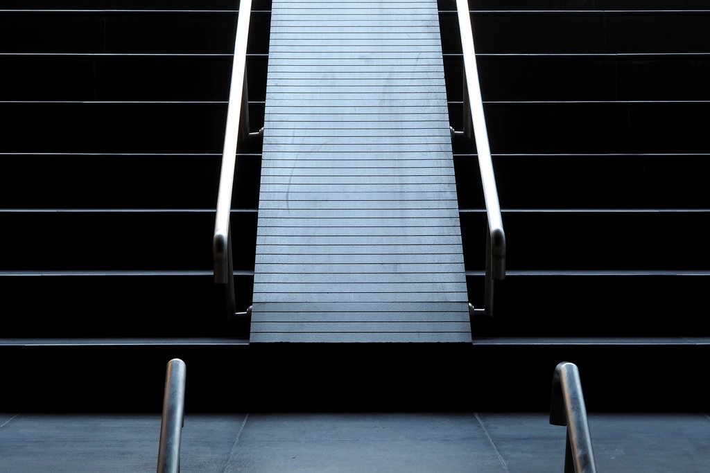 Stair descending between dark walls