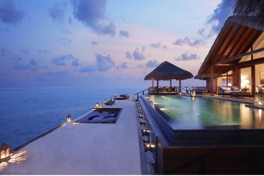 Infinity pool facing the sea at dusk