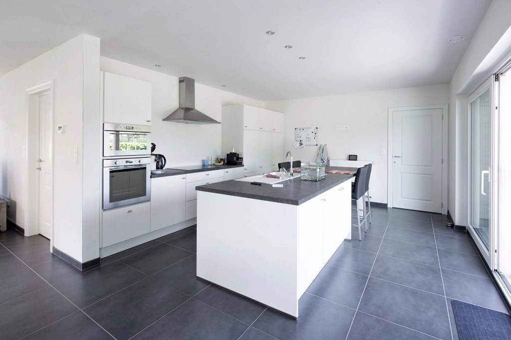 Kitchen island on dark tiles