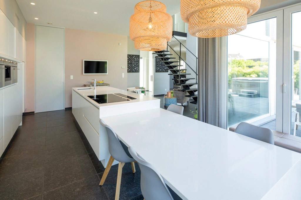 Long kitchen with rattan pendants