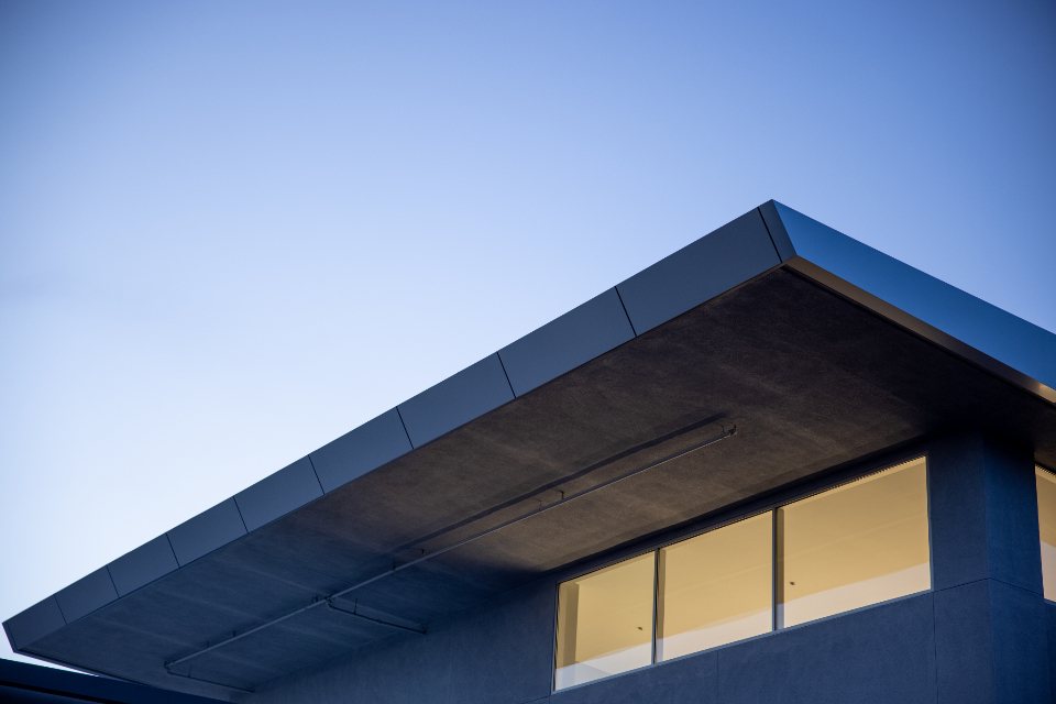 Sharp roof edge against a blue sky