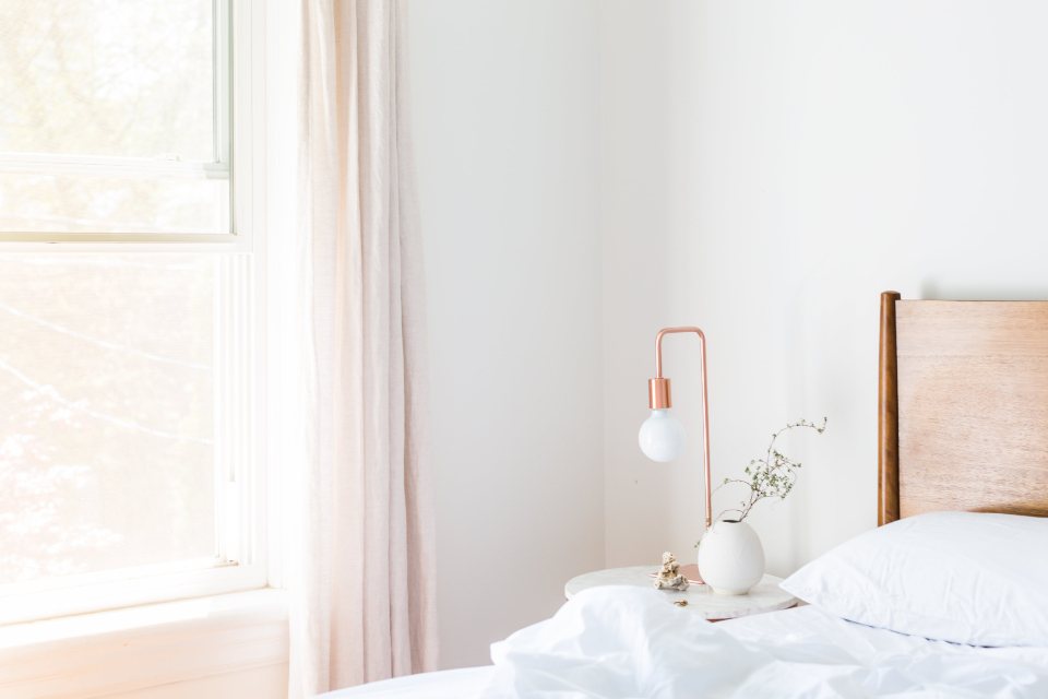 Quiet white bedroom by the window