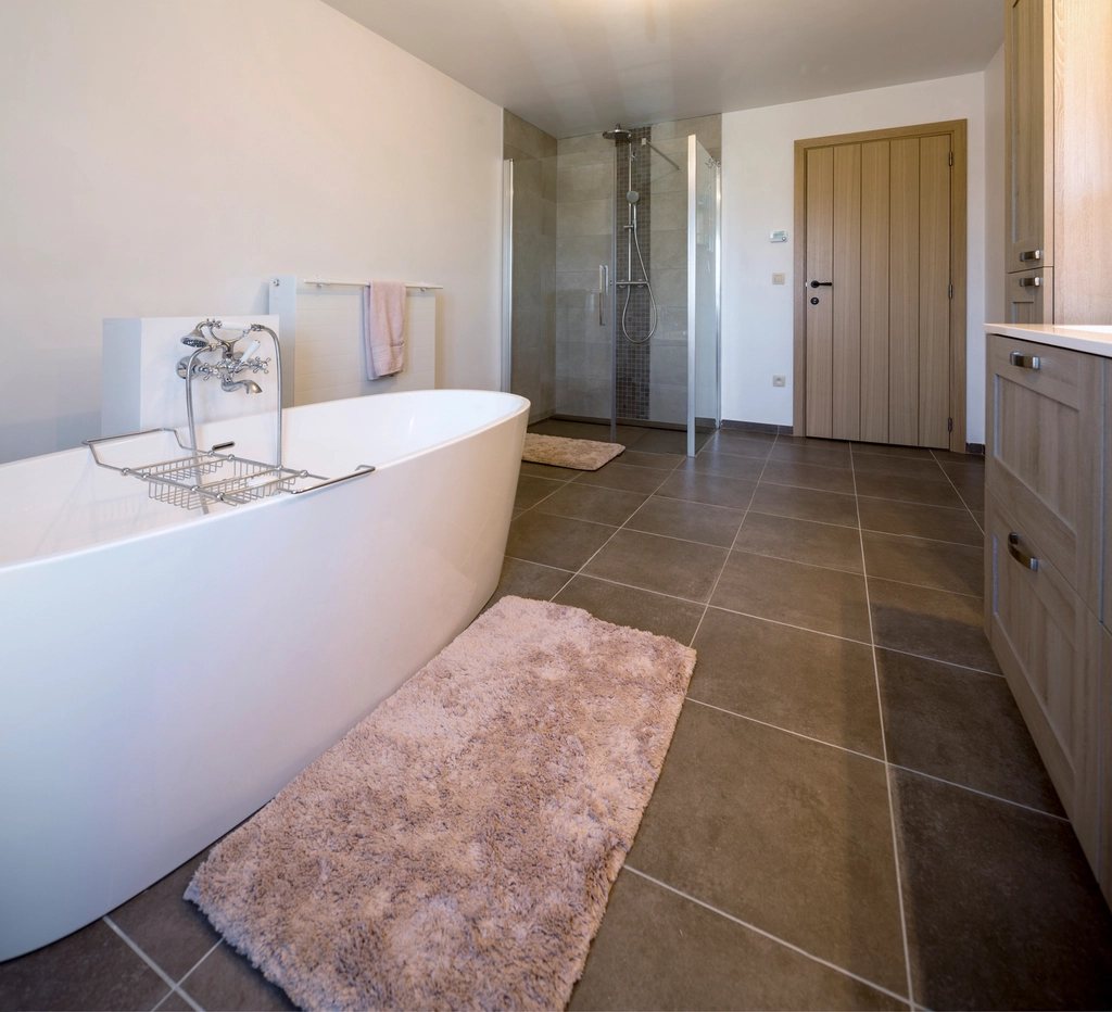 Freestanding bath on stone tiles