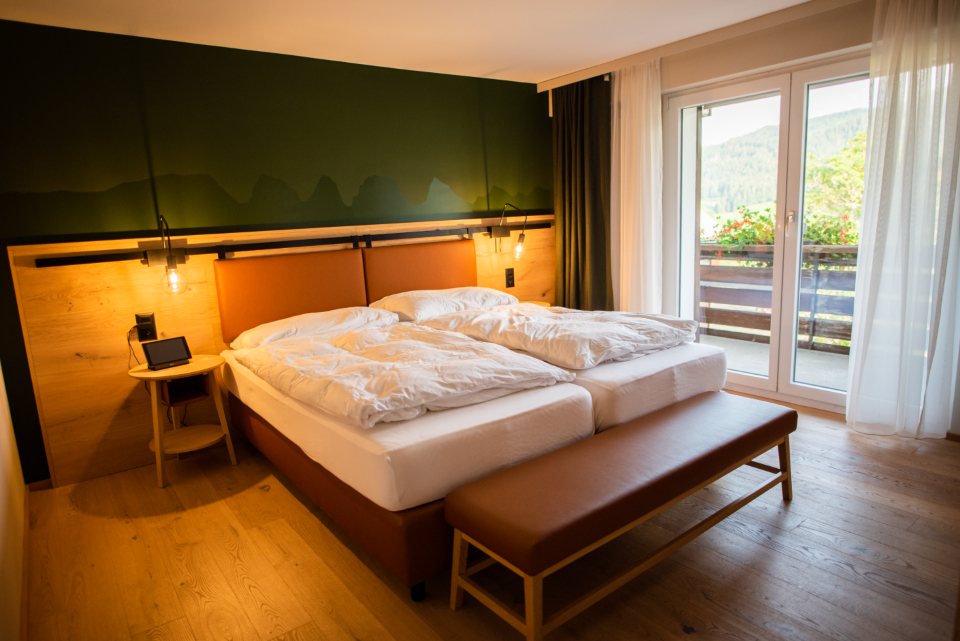 Bedroom with a leather bench at golden hour