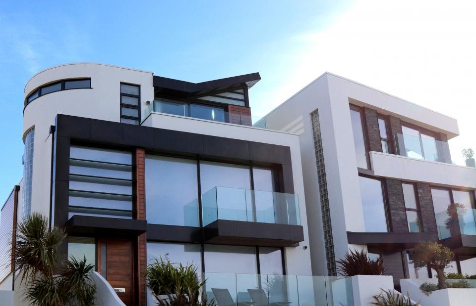 White villa with curved balconies